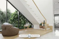 Dưới cầu thang được đặt ghế lười và cũng là nơi đọc sách